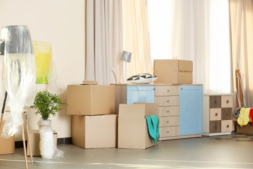Moving boxes and a van during a London home relocation