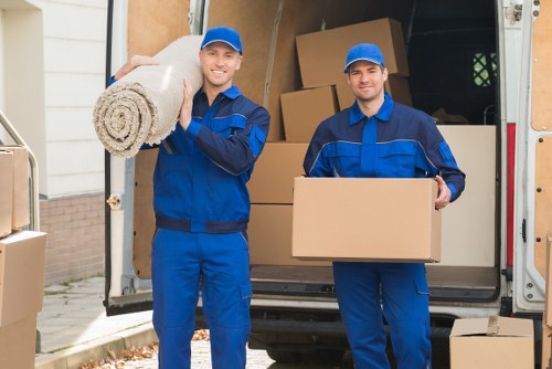 Furniture pick-up service removing a sofa from a London home