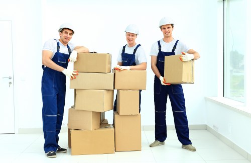 Specialist team managing a piano move through a London property