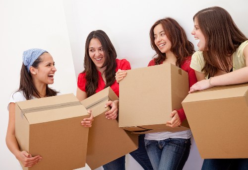 Unpacking service arranging boxes in a new London apartment