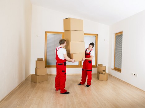 Movers discussing a London removal quote